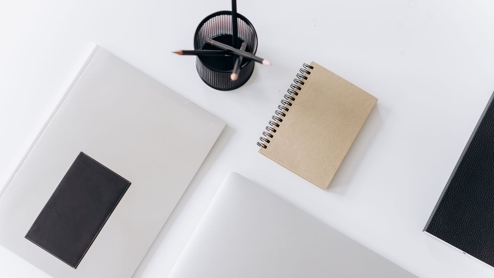 An organized workspace with a tablet and planner, ideal for preparing a brief.