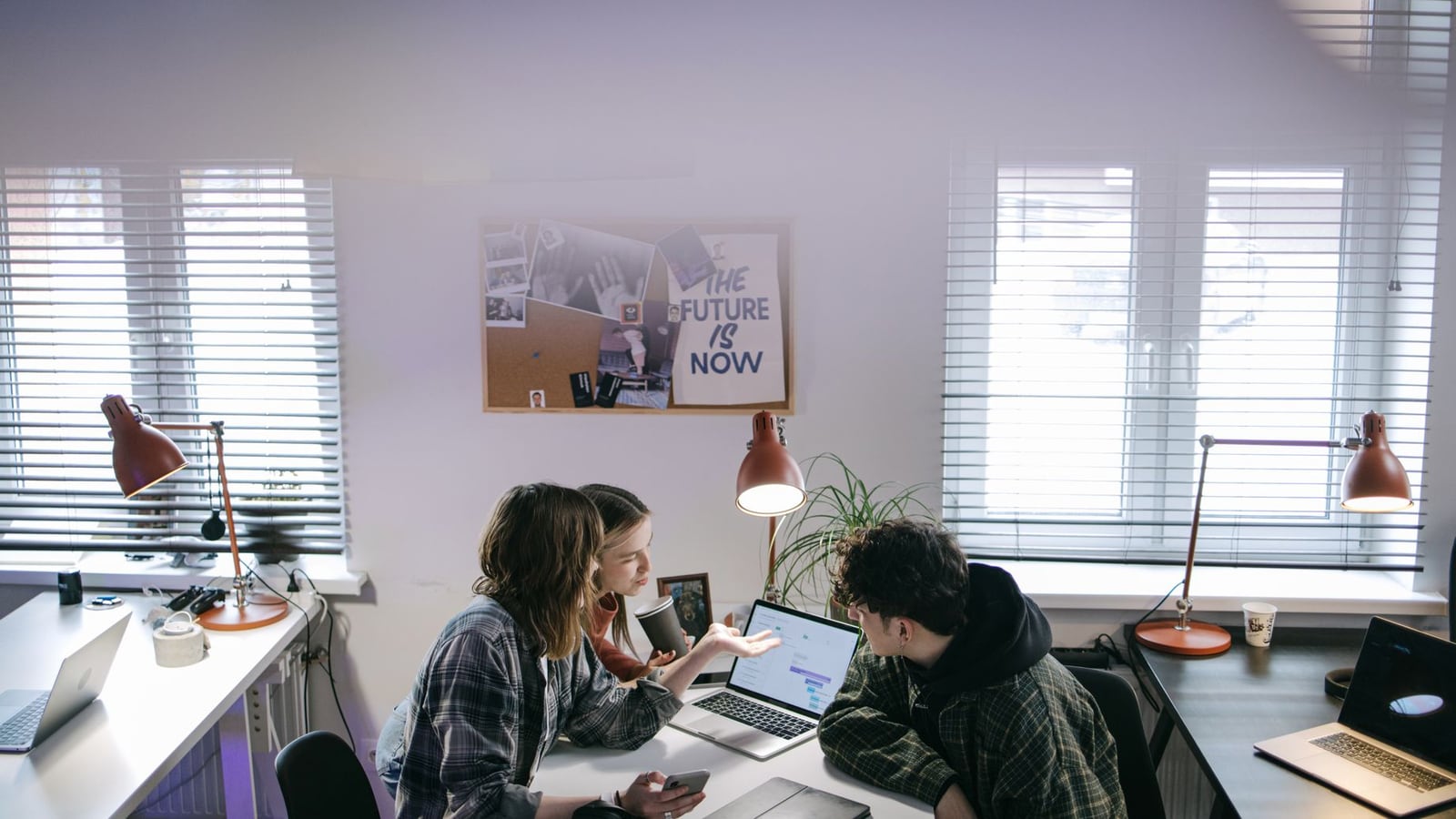 A creative team planning a corporate blog strategy in a modern Montreal office.